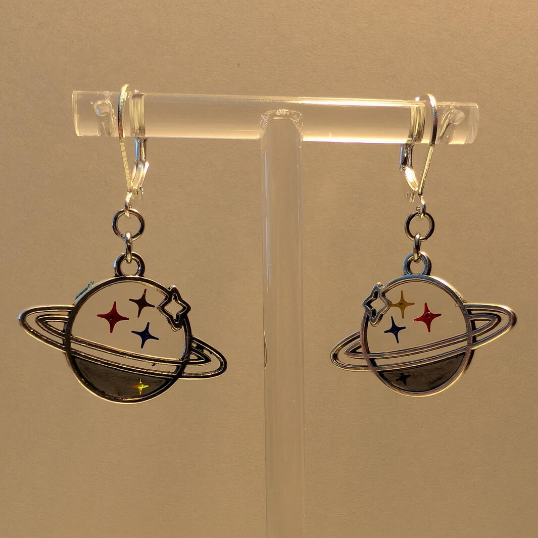 Planets with Steel Mark Inspired inclusions